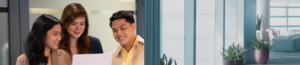 Three people are standing together indoors in a modern office space in the Philippines, smiling and looking at a laptop screen—perfectly capturing a team building moment. Large windows and potted plants brighten the background.